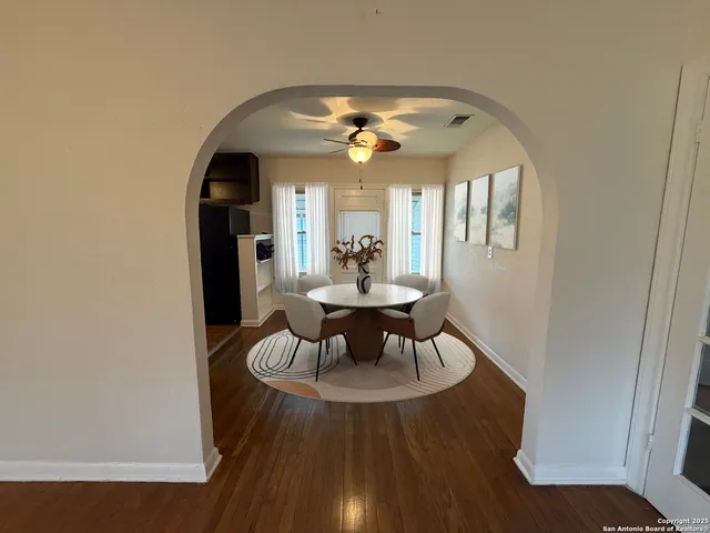 a dining room with furniture and chandelier