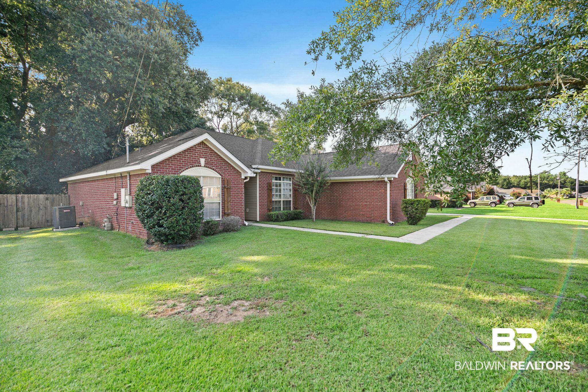 10550 Patrick Avenue Grand Bay, AL 36541 - Photo 3 of 43 Ranch-style house featuring central AC and a front yard