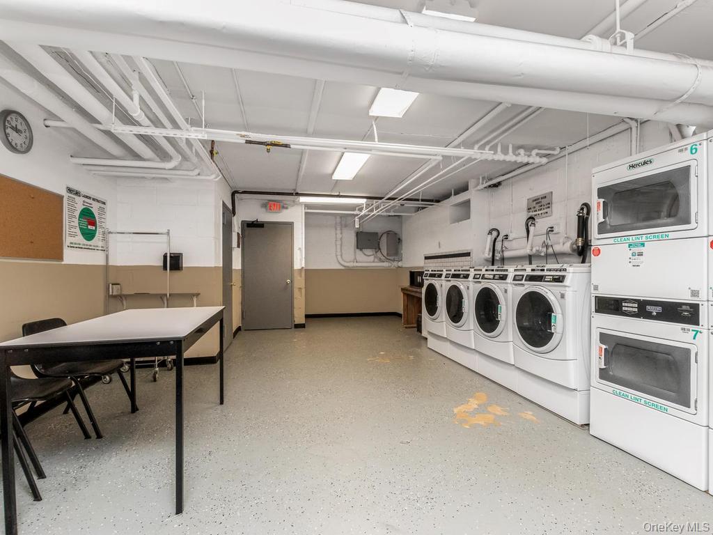 25 Trinity Place, Unit 3J New Rochelle, NY 10805 - Photo 10 of 15 Dedicated laundry facility featuring multiple commercial-grade washing machines and stacked dryers