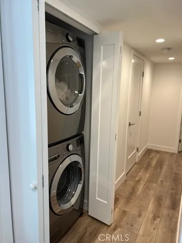 a view of a hallway with washer and dryer