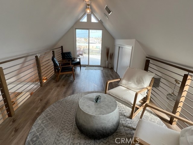 123 36th Street Newport Beach, CA 92663 - Photo 14 of 22 a living room with furniture and a wooden floor