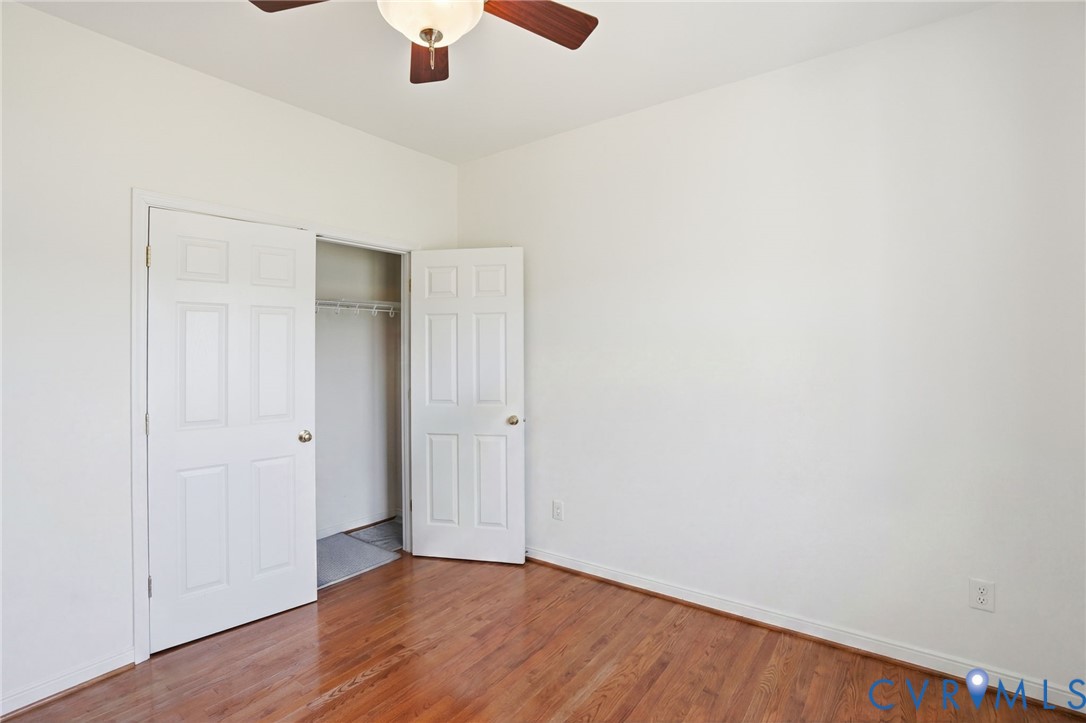 5305 Wellington Ridge Road Richmond, VA 23231 - Photo 40 of 67 Room featuring wood-finish flooring, white walls,