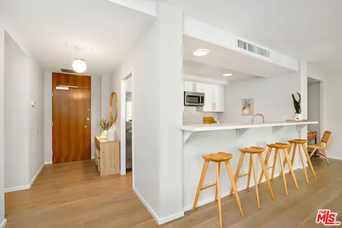 a view of kitchen with furniture and wooden floor