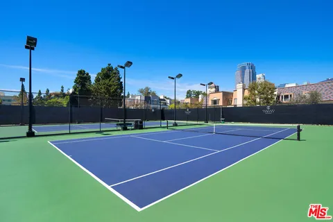 a front view of a building with a garden