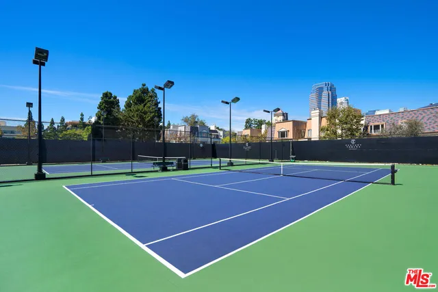 a front view of a building with a garden