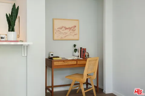 a dining room with table and chairs