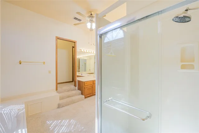 a bathroom with a tub and shower