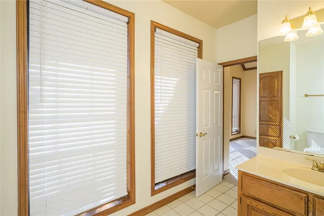 a bathroom with a tub shower and a sink
