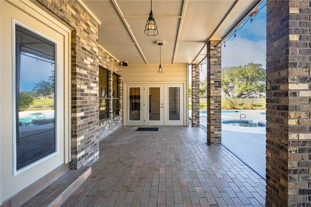 a view of an entryway with a floor to ceiling window