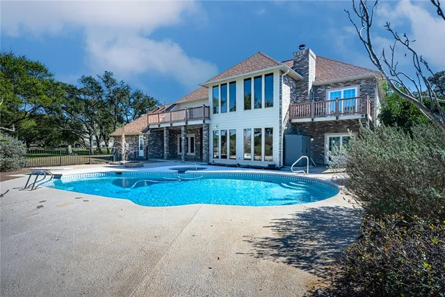 a view of a house with swimming pool