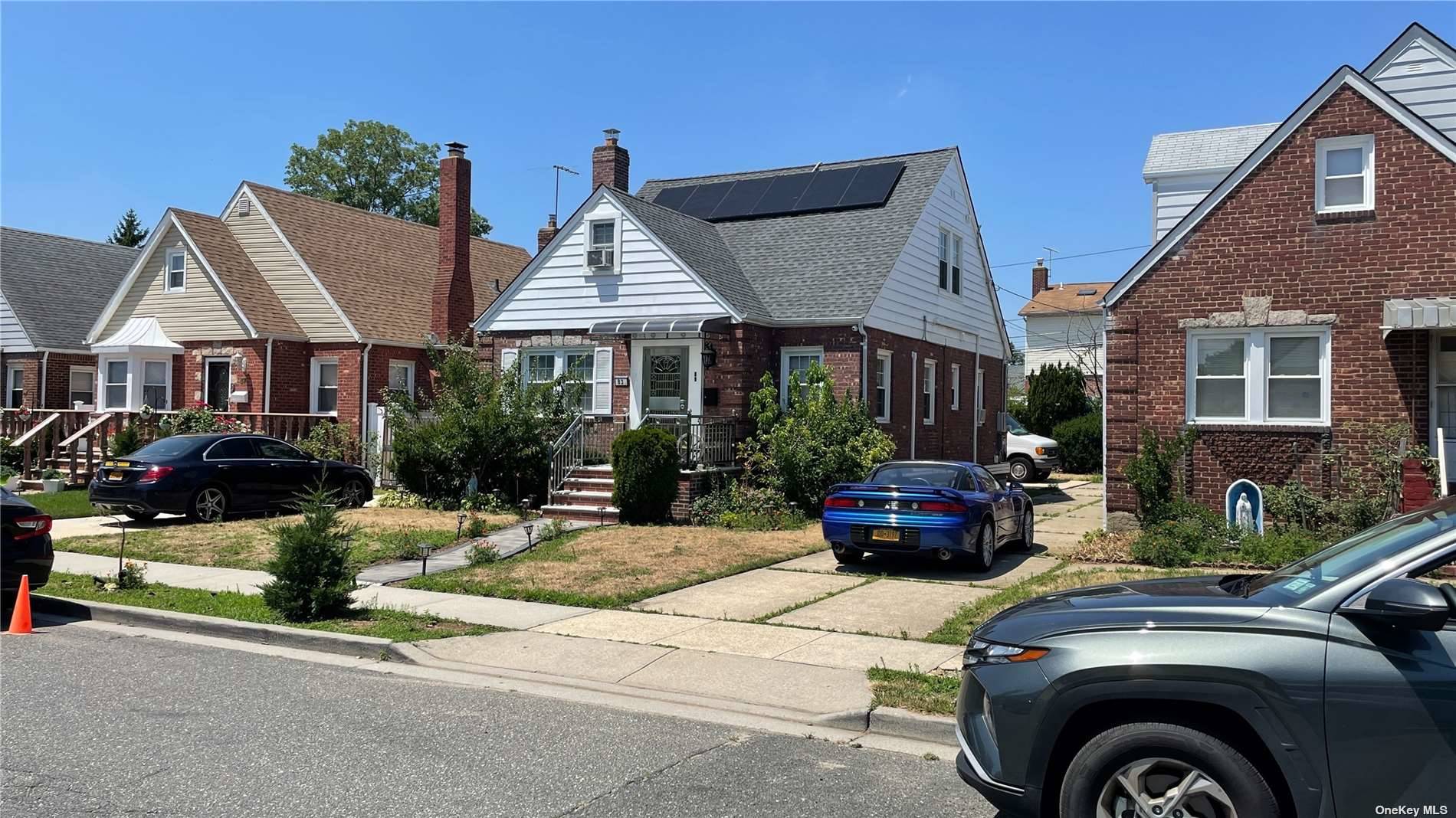 83 Sussex Road Elmont, NY 11003 - Photo 1 of 1 a front view of a house with sitting area