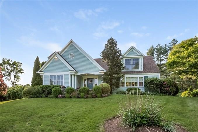 153 Chestnut Hill Road Wilton, CT 06897 - Photo 1 of 1 a front view of a house with a yard and trees