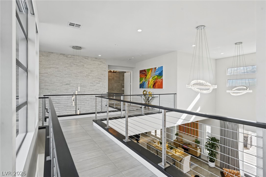 4208 Lapis Ridge Court Las Vegas, NV 89135 - Photo 20 of 61 An airy upper-level walkway overlooks the main living areas through sleek cable railings.