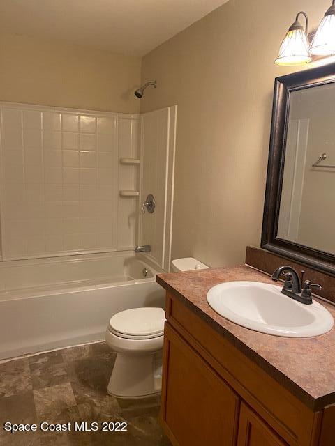4220 James Road Cocoa, FL 32926 - Photo 30 of 34 a bathroom with a granite countertop sink toilet and shower