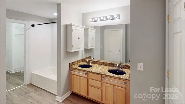 a kitchen with a refrigerator a stove a washer and dryer