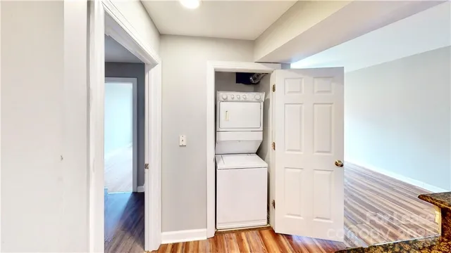 a view of washer and dryer with wooden floor