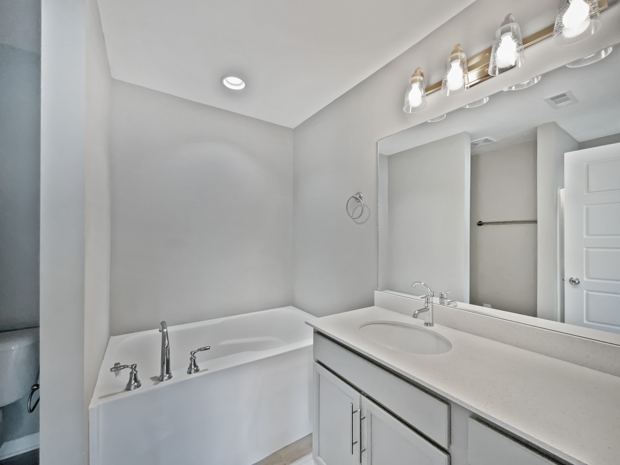 3529 Learning Lane Murfreesboro, TN 37128 - Photo 7 of 22 a bathroom with a sink vanity granite tub and mirror