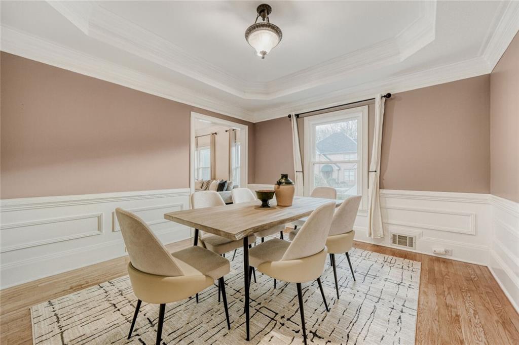 2672 Henderson Ridge Drive Tucker, GA 30084 - Photo 11 of 46 a view of a dining room with furniture window and wooden floor
