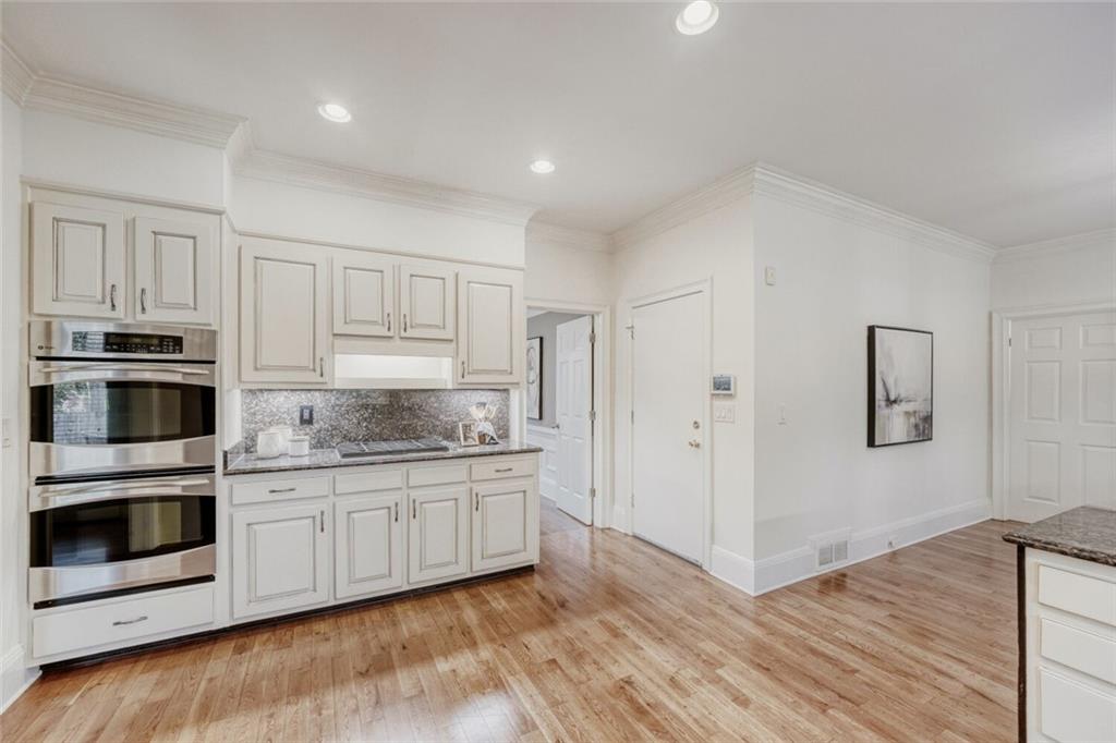 2672 Henderson Ridge Drive Tucker, GA 30084 - Photo 15 of 46 a kitchen with stainless steel appliances granite countertop a stove and a sink