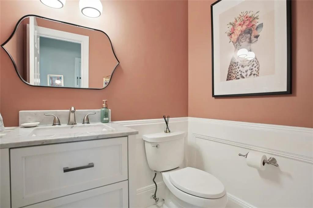 2672 Henderson Ridge Drive Tucker, GA 30084 - Photo 17 of 46 a bathroom with a toilet a sink and mirror