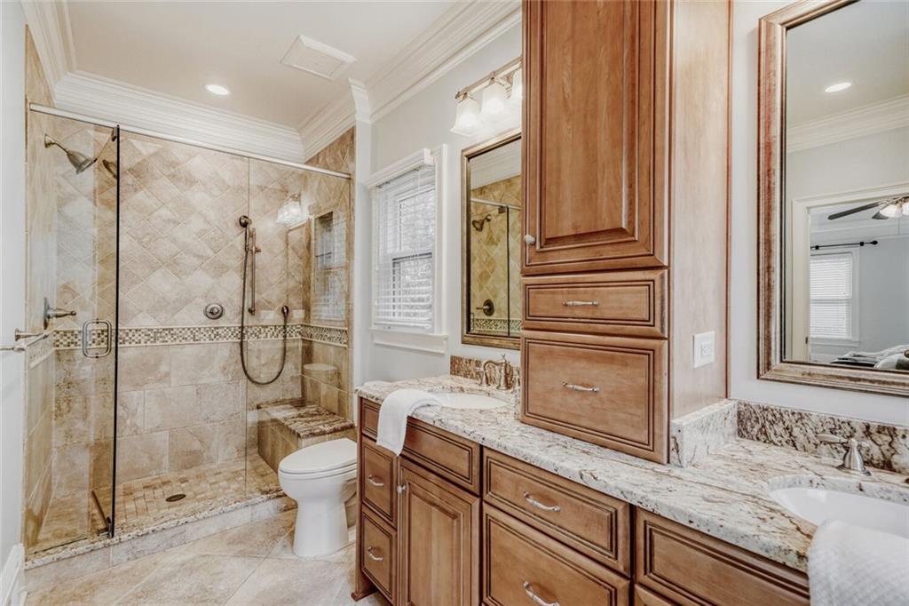 2672 Henderson Ridge Drive Tucker, GA 30084 - Photo 21 of 46 a bathroom with a granite countertop sink toilet and shower
