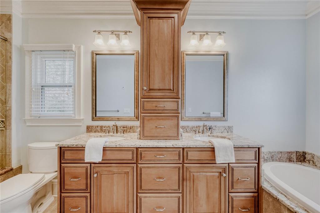 2672 Henderson Ridge Drive Tucker, GA 30084 - Photo 23 of 46 a bathroom with a sink vanity and mirror