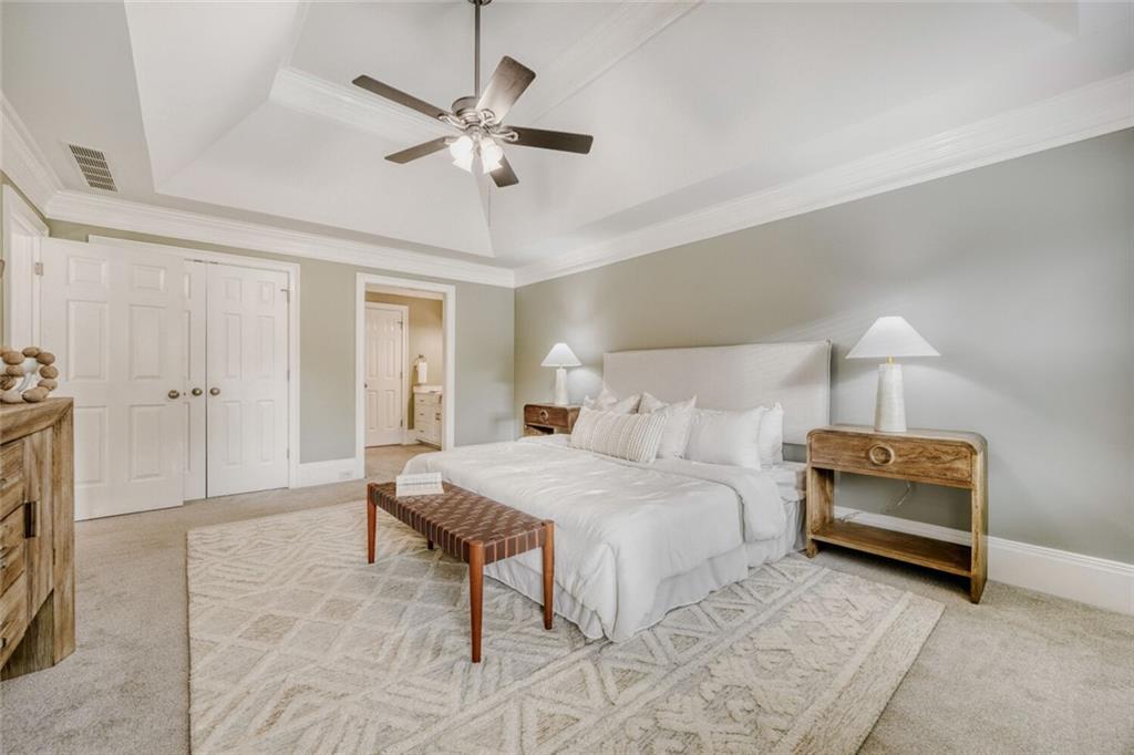 2672 Henderson Ridge Drive Tucker, GA 30084 - Photo 26 of 46 a bedroom with a bed and a ceiling fan