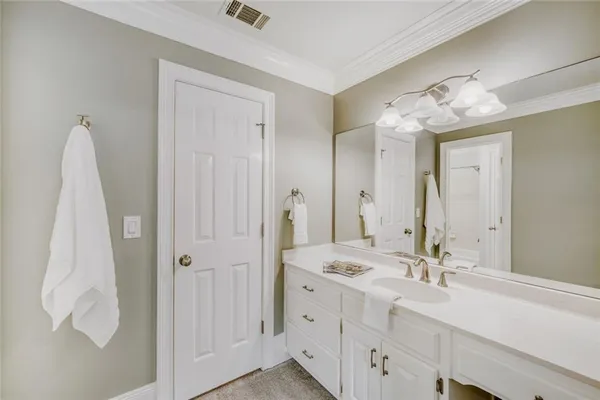 a bathroom with a double vanity sink mirror and