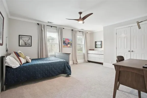 a bedroom with a bed and a furniture