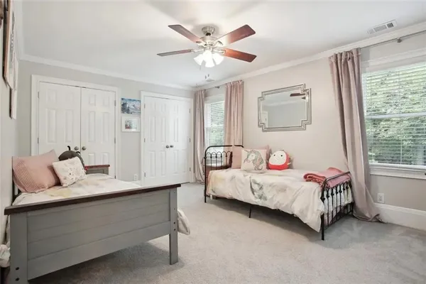 a bedroom with a bed and window