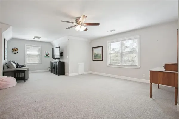 a view of livingroom with furniture and windows