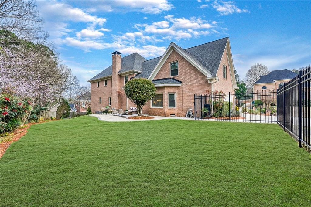2672 Henderson Ridge Drive Tucker, GA 30084 - Photo 46 of 46 a front view of a house with garden