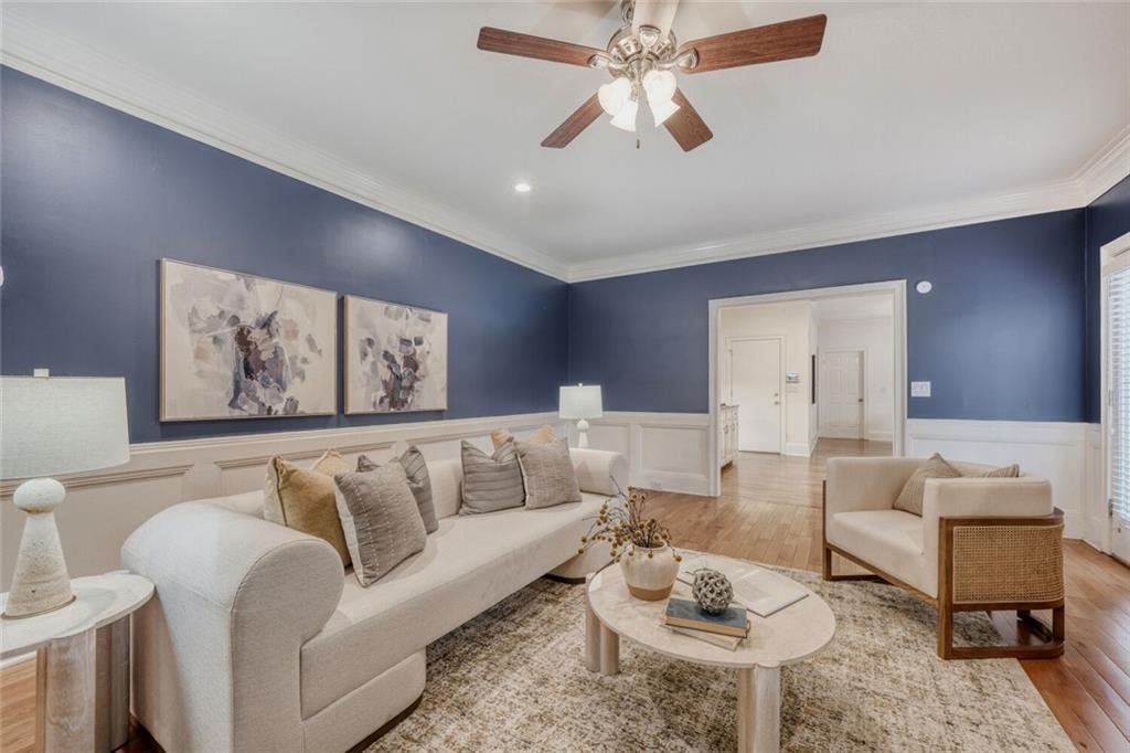 2672 Henderson Ridge Drive Tucker, GA 30084 - Photo 8 of 46 a living room with furniture a rug and a chandelier