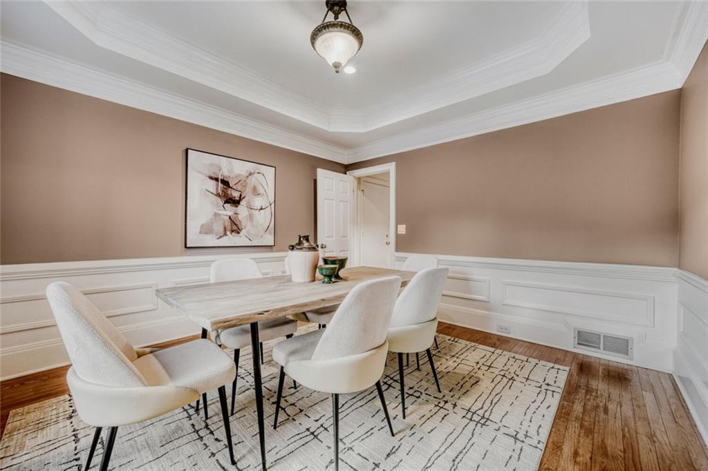 2672 Henderson Ridge Drive Tucker, GA 30084 - Photo 10 of 46 a view of a dining room with furniture and wooden floor