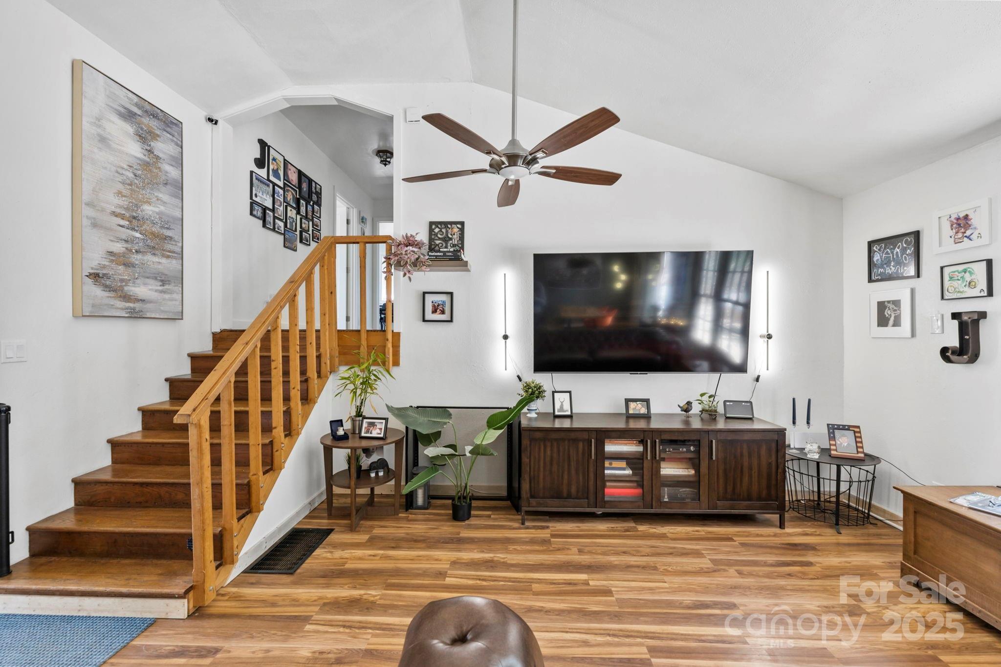 7923 Cruso Road Canton, NC 28716 - Photo 4 of 16 a living room with wooden floor and a flat screen tv