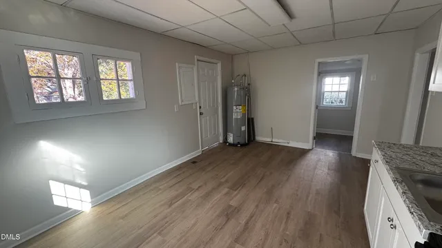 a view of entryway with wooden floor and fan