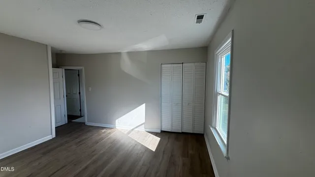 a view of entryway with wooden floor