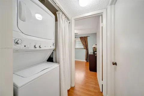a view of a hallway with washer and dryer