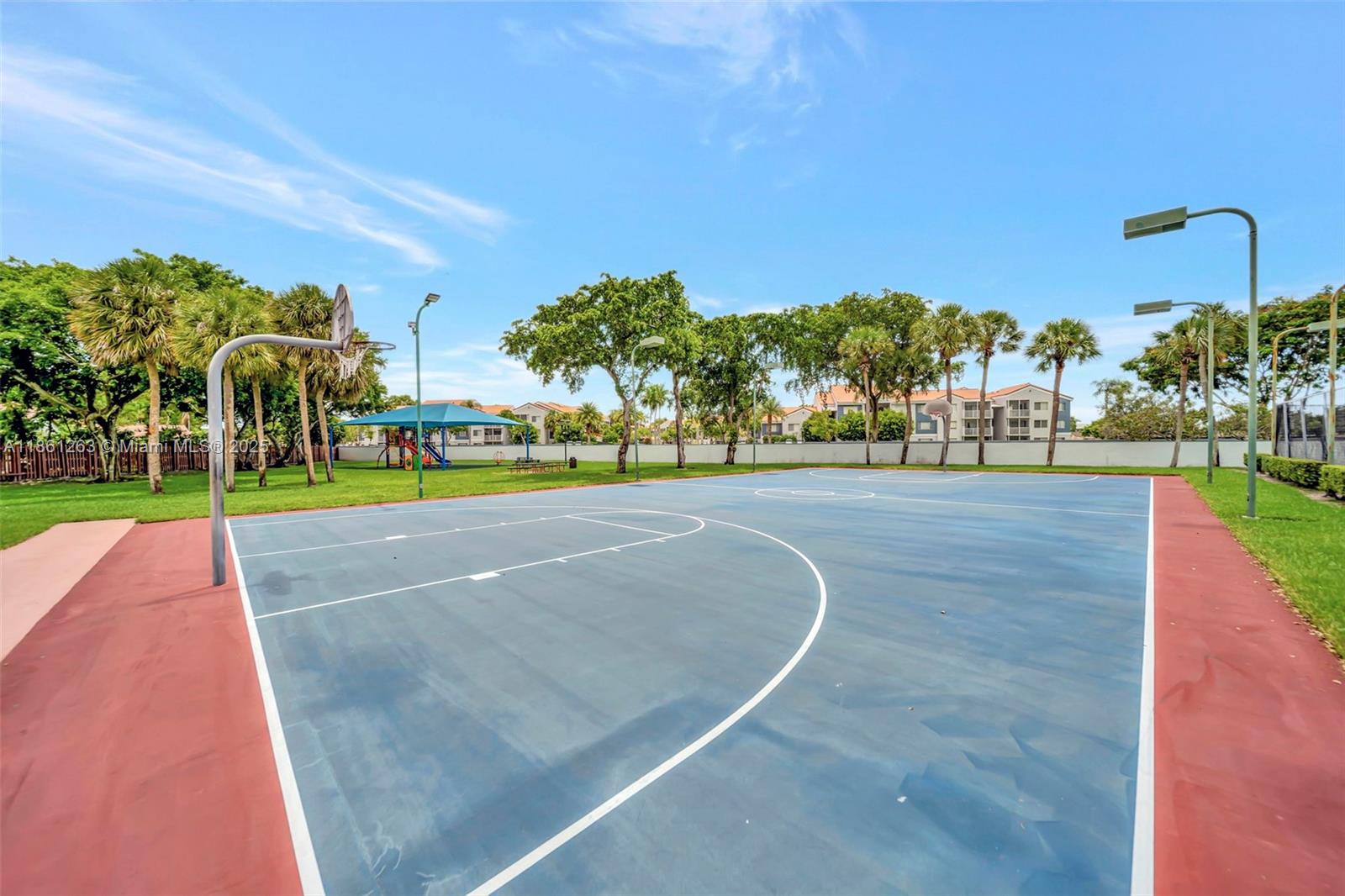 18224 Mediterranean Boulevard, Unit 61706 Hialeah, FL 33015 - Photo 40 of 50 a view of a playground with basketball court