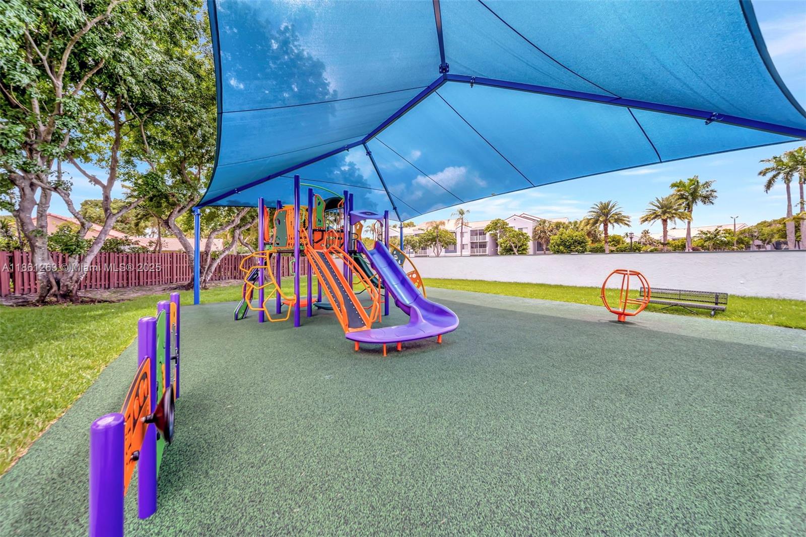 18224 Mediterranean Boulevard, Unit 61706 Hialeah, FL 33015 - Photo 42 of 50 a view of outdoor space with playground and green space