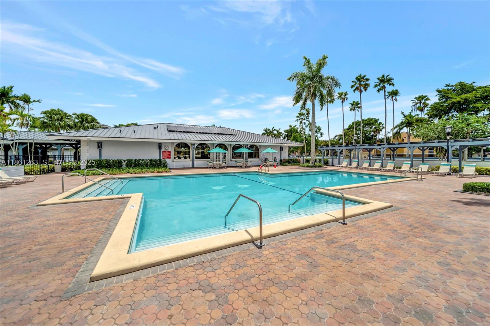 18224 Mediterranean Boulevard, Unit 61706 Hialeah, FL 33015 - Photo 48 of 50 an outdoor space with swimming pool and furniture
