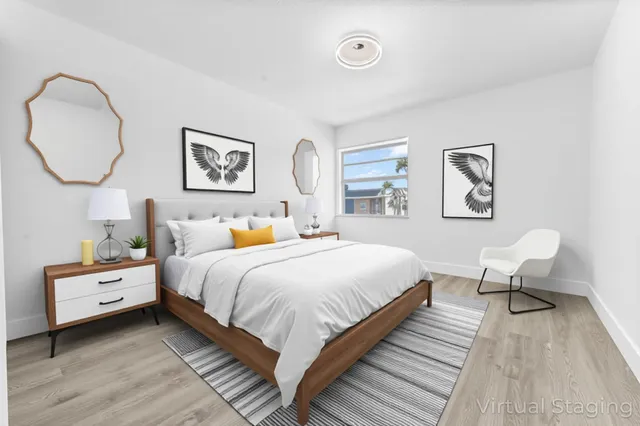 a bedroom with bed and a window