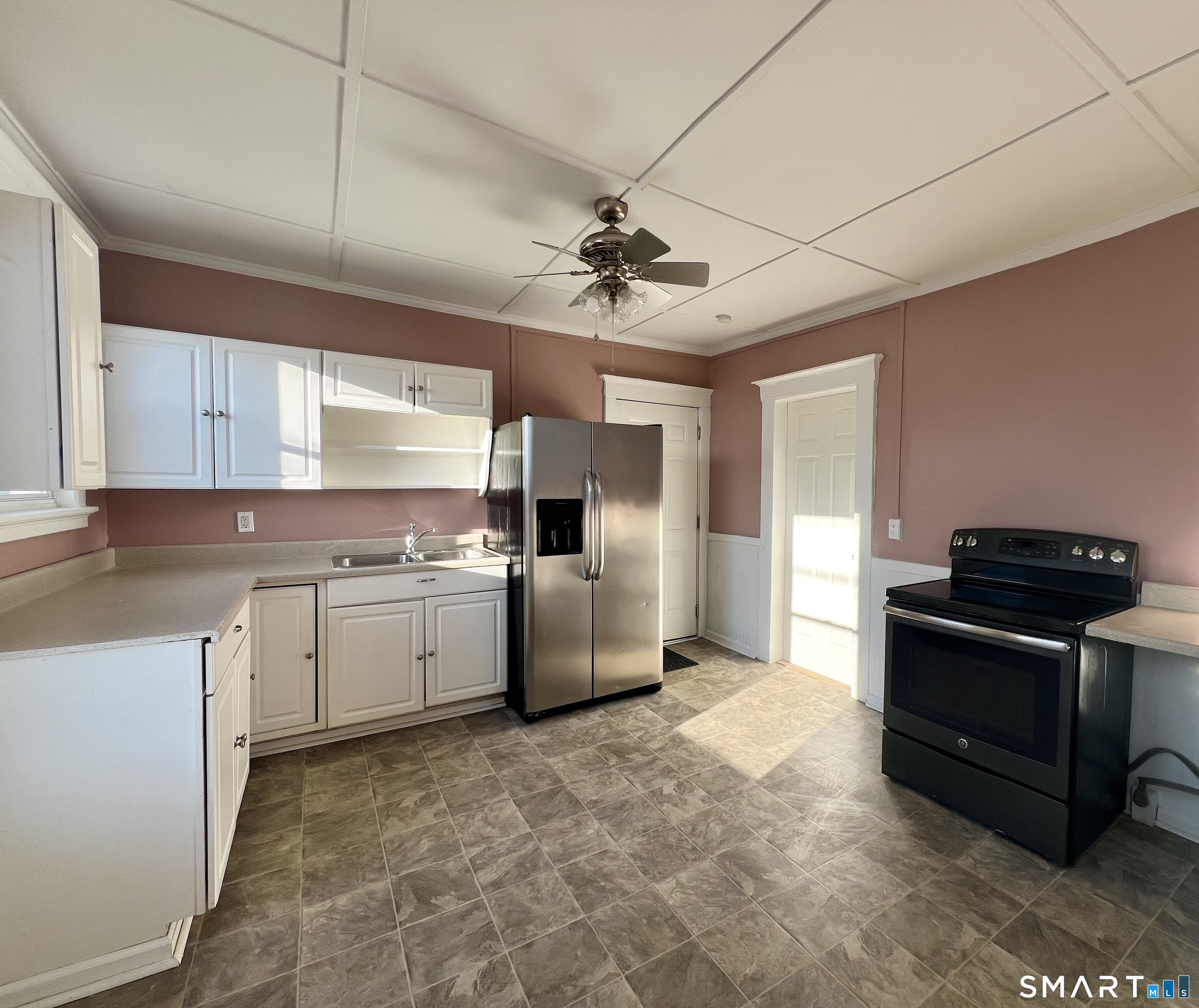 154 High Street Torrington, CT 06790 - Photo 11 of 36 a kitchen with granite countertop a sink stove and refrigerator