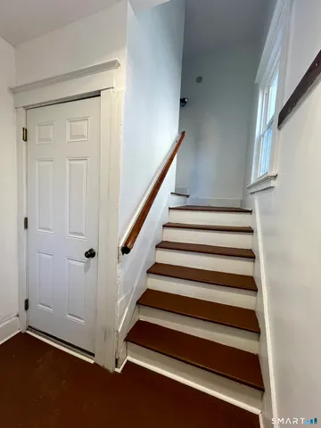 a view of an entryway with wooden floor