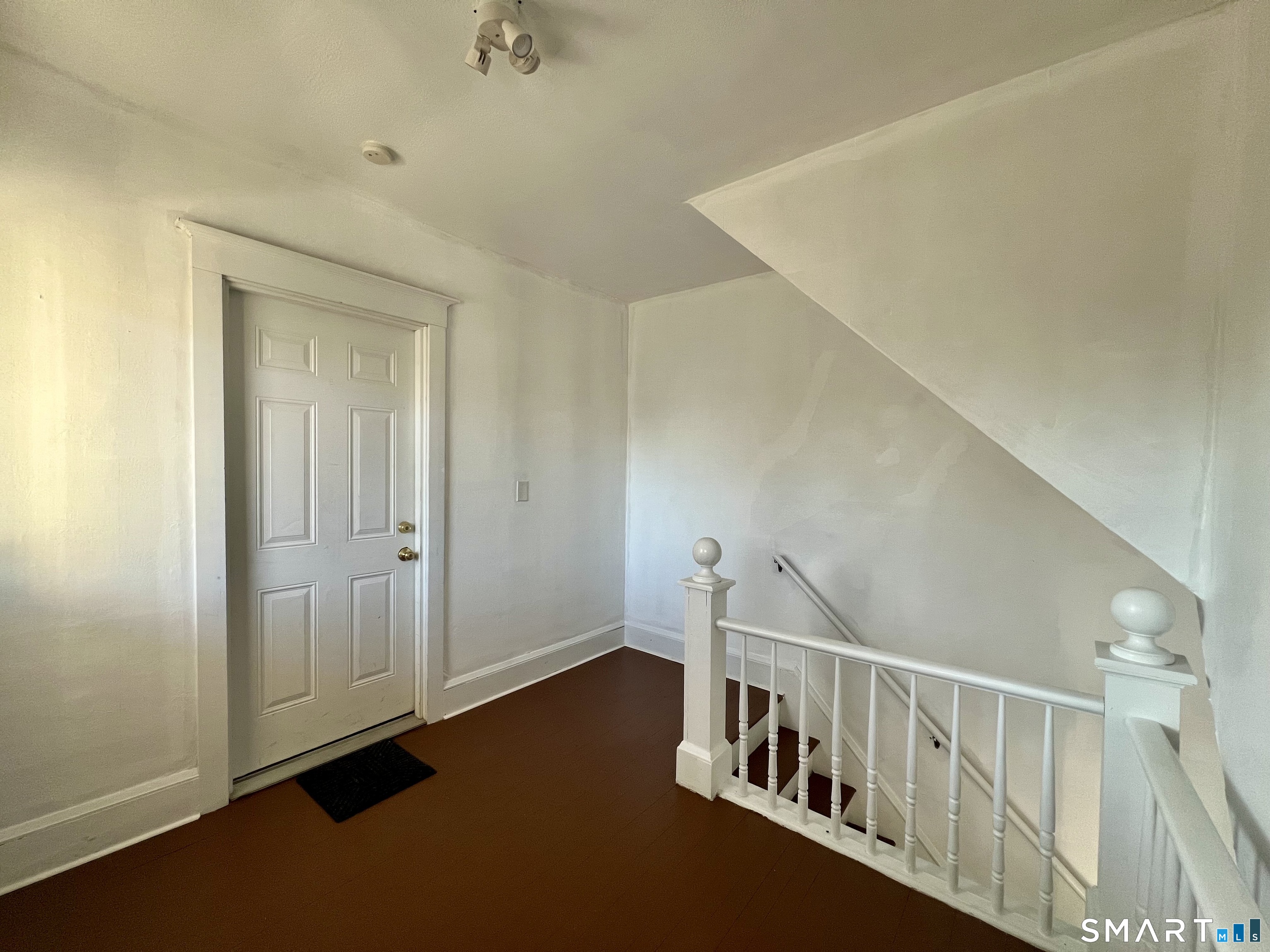 154 High Street Torrington, CT 06790 - Photo 16 of 36 a view of an entryway with wooden floor