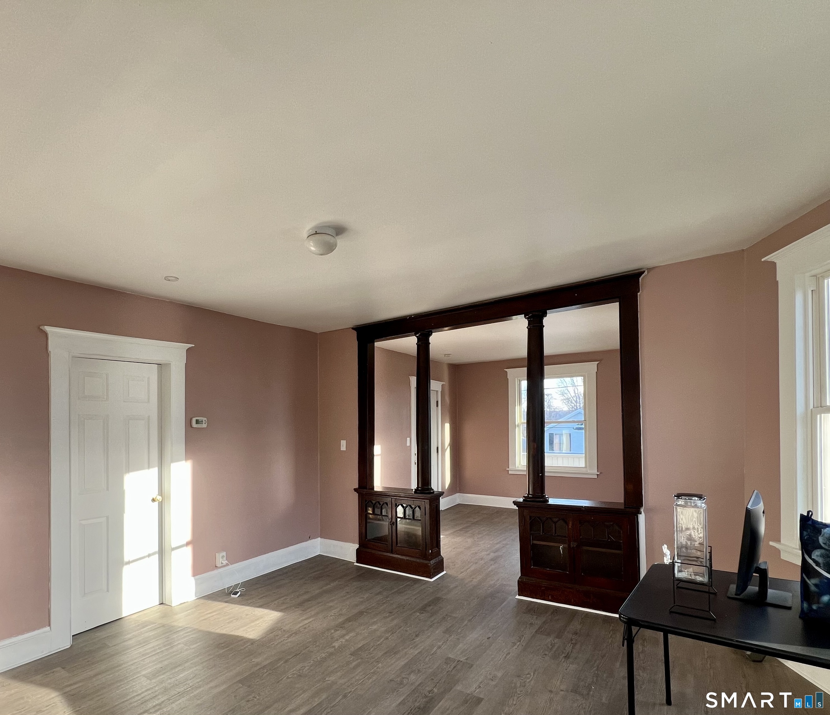 154 High Street Torrington, CT 06790 - Photo 18 of 36 wooden floor in an empty room with a window