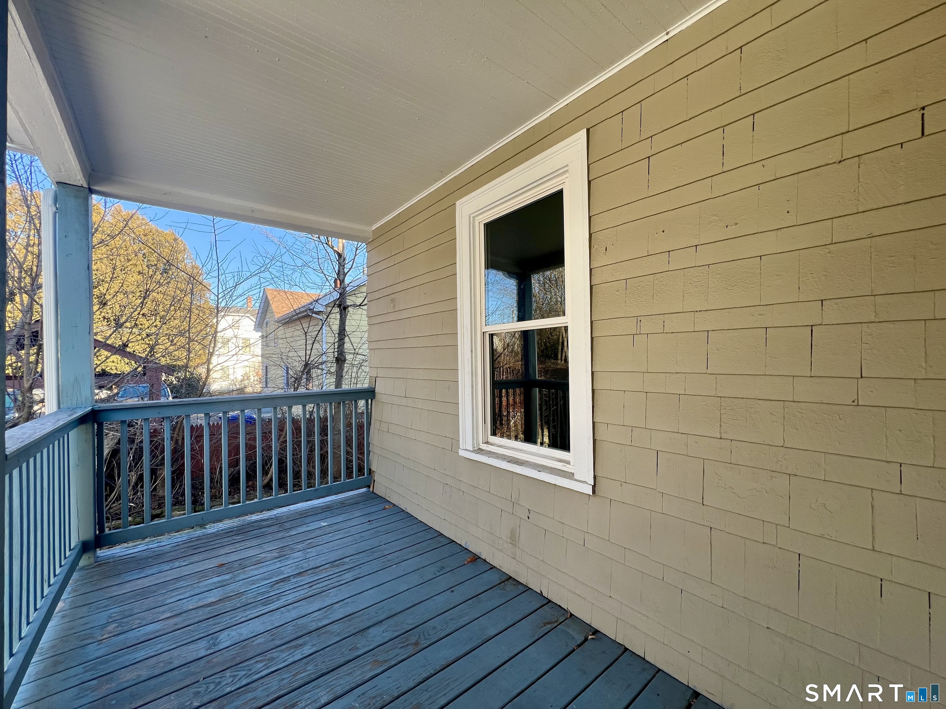 154 High Street Torrington, CT 06790 - Photo 26 of 36 a view of an empty room with wooden floor and a window