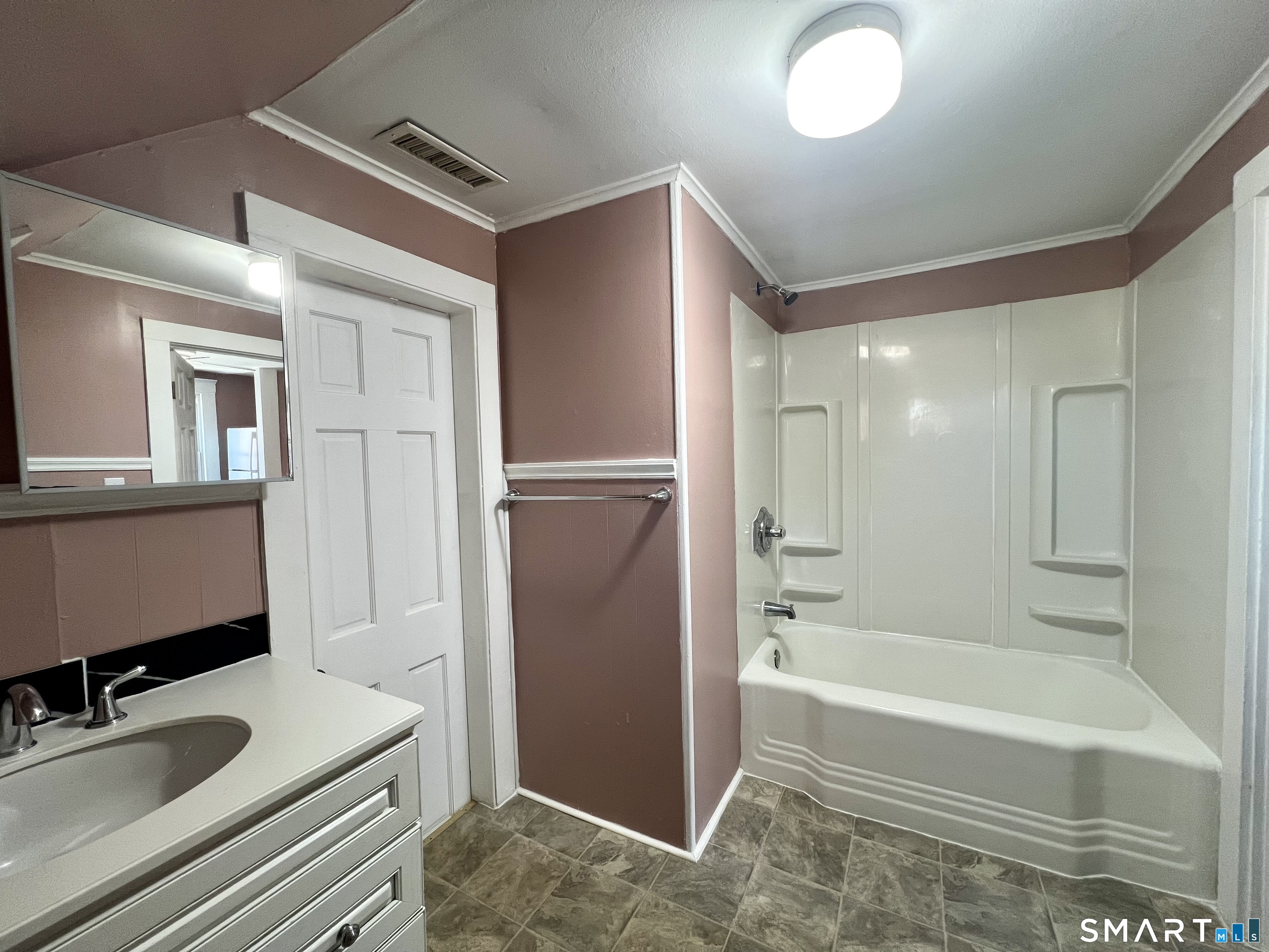 154 High Street Torrington, CT 06790 - Photo 31 of 36 a bathroom with a tub sink and mirror