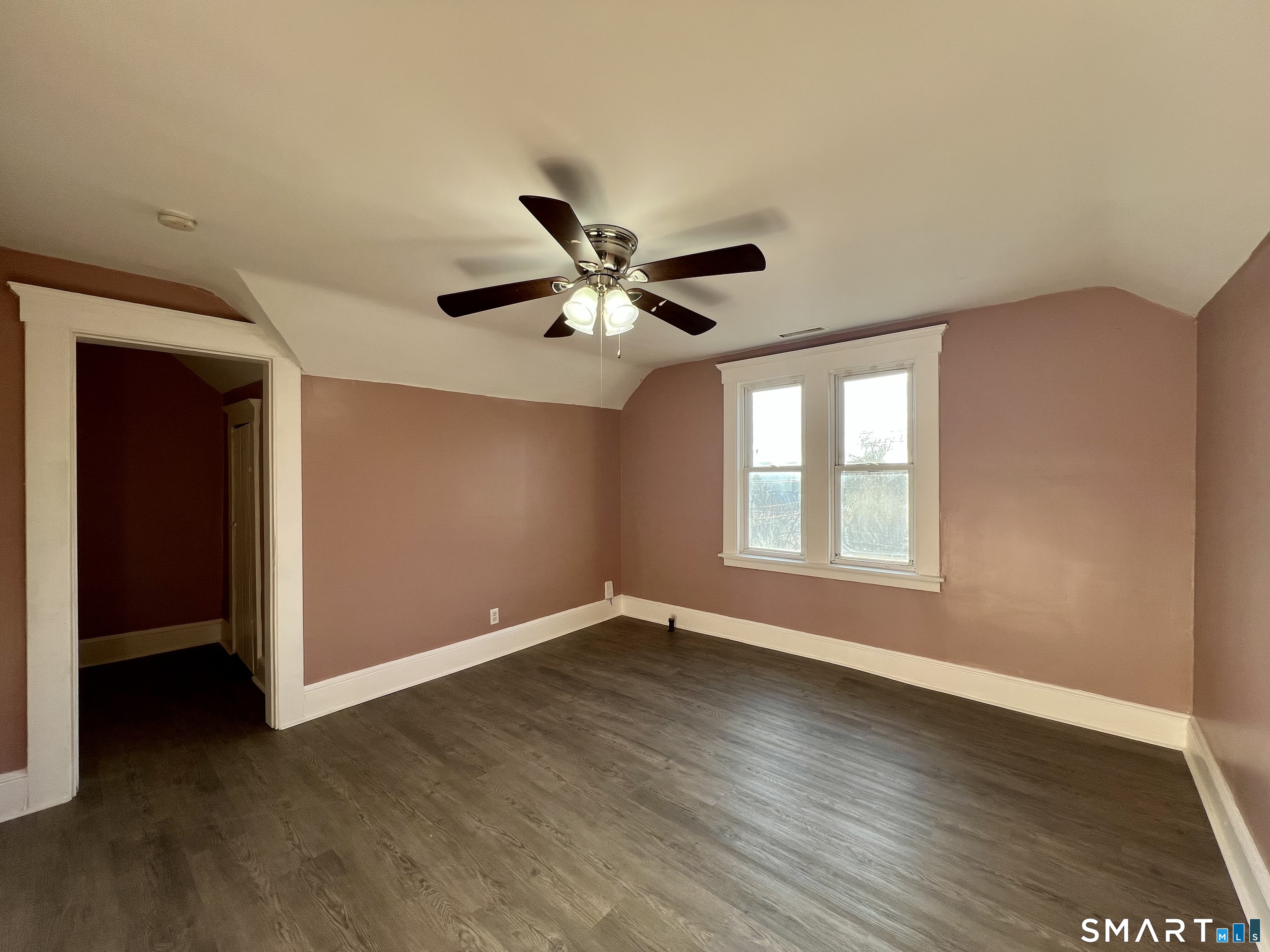 154 High Street Torrington, CT 06790 - Photo 33 of 36 a view of an empty room with wooden floor and a ceiling fan