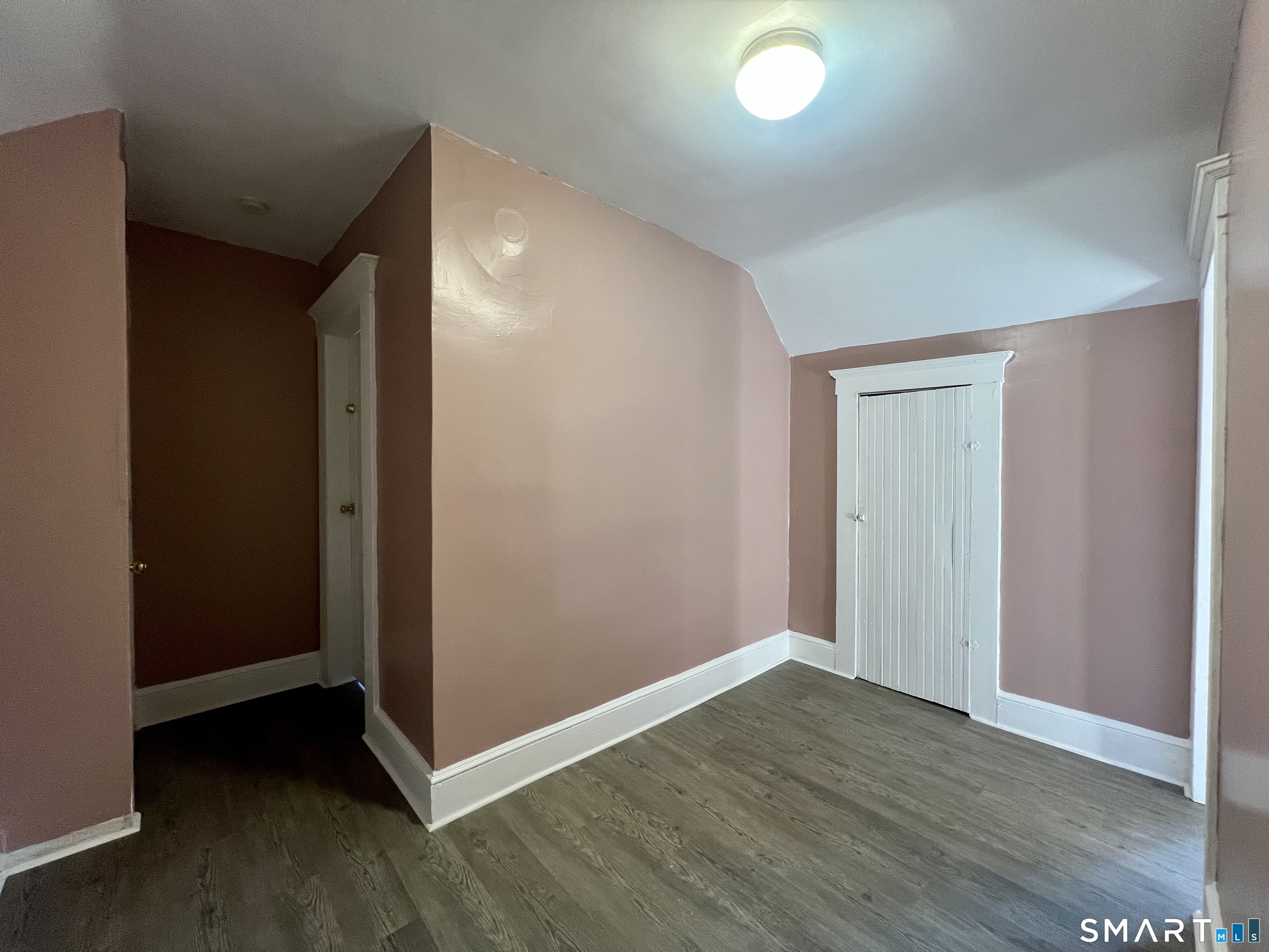 154 High Street Torrington, CT 06790 - Photo 36 of 36 an empty room with wooden floor and windows